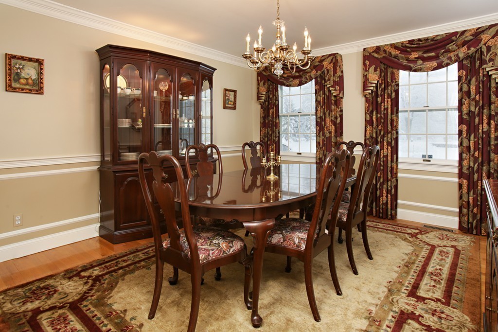 321 Concord Road Wayland, MA 01778 - Photo 5 of 12 a view of a dining room with furniture and chandelier