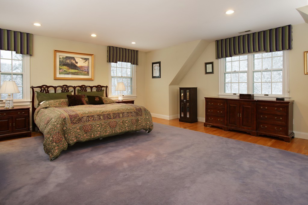 321 Concord Road Wayland, MA 01778 - Photo 7 of 12 a bedroom with a bed and a large window