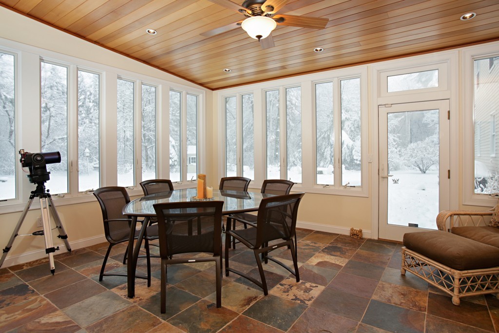 321 Concord Road Wayland, MA 01778 - Photo 8 of 12 a view of a dining room with furniture and large windows