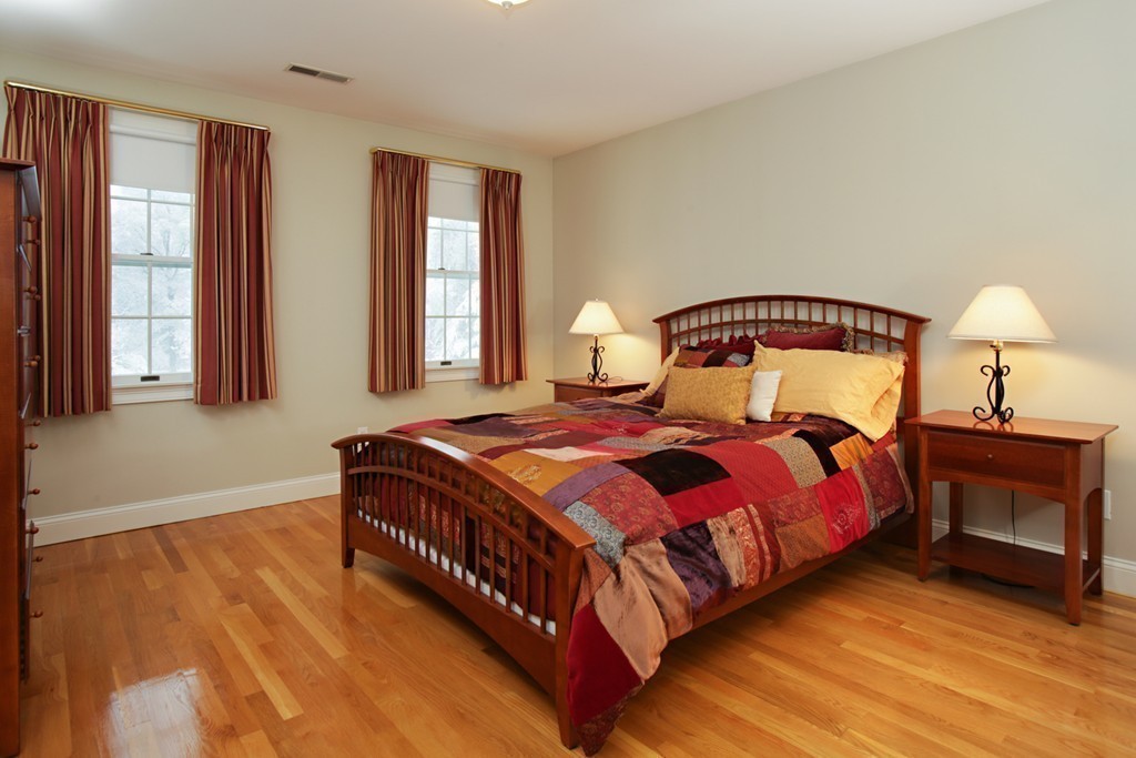 321 Concord Road Wayland, MA 01778 - Photo 9 of 12 a bedroom with a bed and window