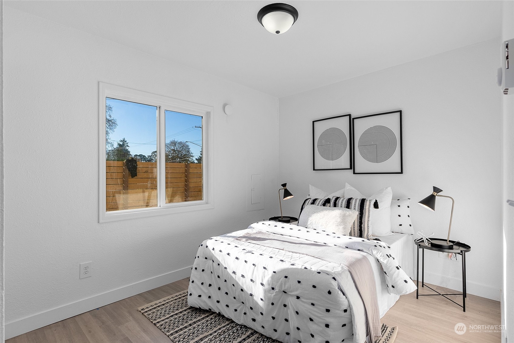 14915 Portland Avenue Southwest Lakewood, WA 98498 - Photo 14 of 24 a bedroom with a bed and a window