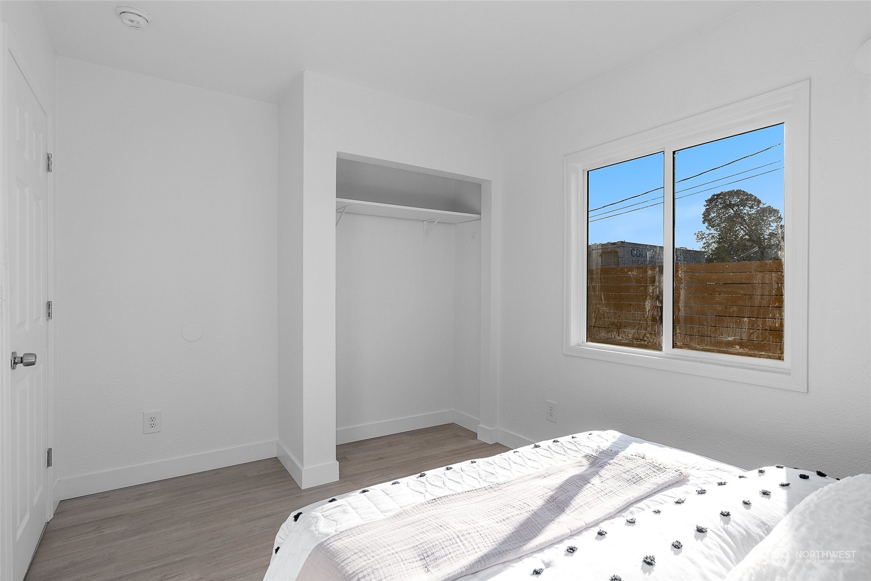 14915 Portland Avenue Southwest Lakewood, WA 98498 - Photo 15 of 24 a bedroom with a bed and a window