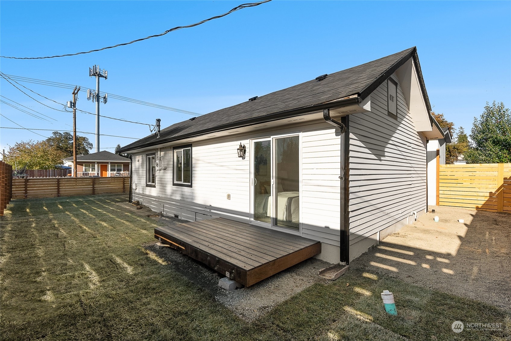 14915 Portland Avenue Southwest Lakewood, WA 98498 - Photo 19 of 24 a front view of a house with a garden