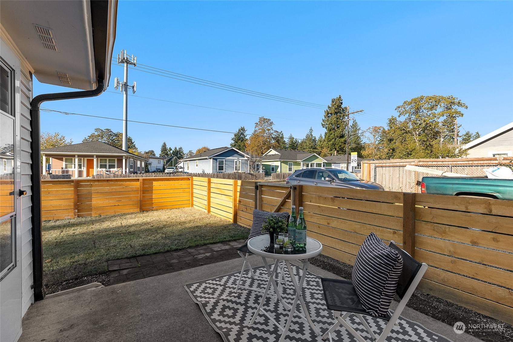 14915 Portland Avenue Southwest Lakewood, WA 98498 - Photo 21 of 24 a view of a balcony with floor to ceiling windows and wooden floor