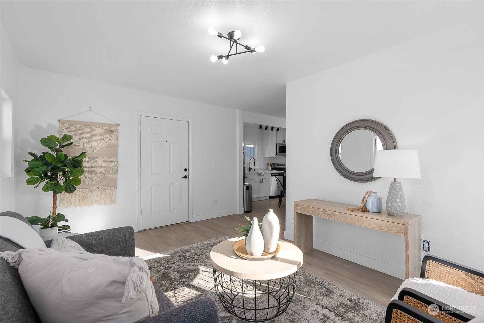 14915 Portland Avenue Southwest Lakewood, WA 98498 - Photo 3 of 24 a living room with furniture and a potted plant