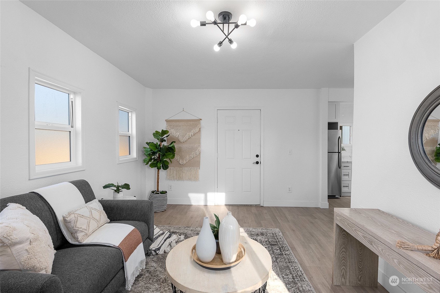 14915 Portland Avenue Southwest Lakewood, WA 98498 - Photo 4 of 24 a living room with furniture potted plant and a window