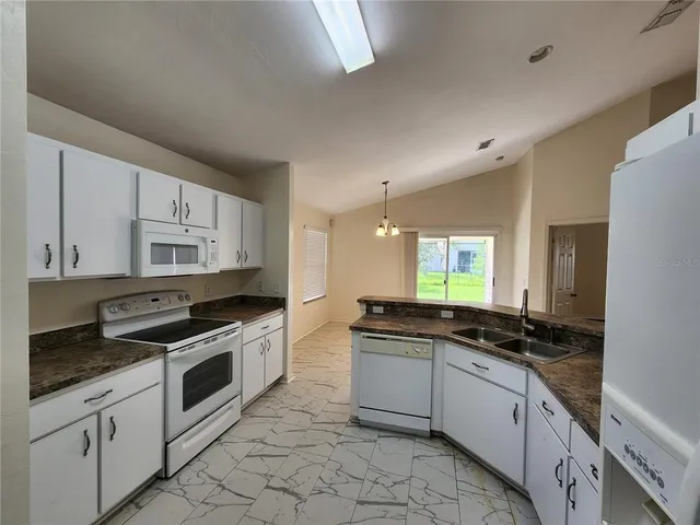 a view of a windows and chandelier in a room