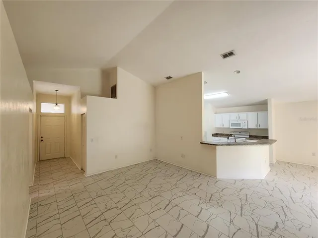 a view of a kitchen with a sink