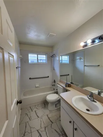 a view of a hallway with closet area