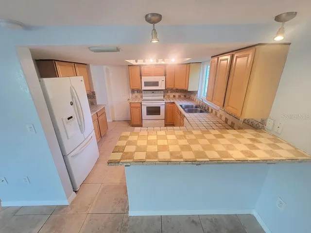 a view of a kitchen with a sink