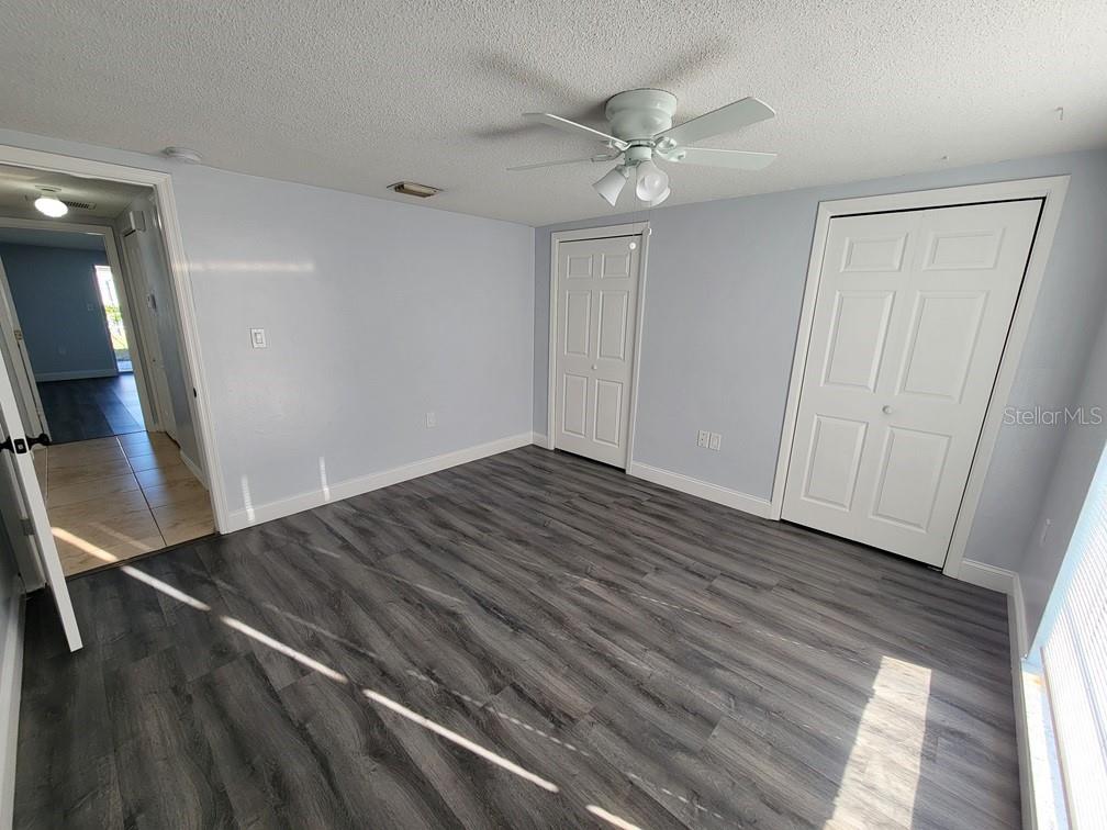7741 Treasure Pointe Drive Port Richey, FL 34668 - Photo 19 of 20 wooden floor in an empty room