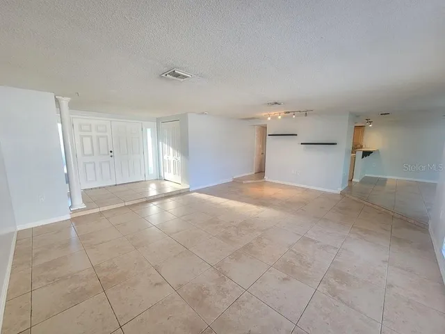 a view of a livingroom and a kitchen