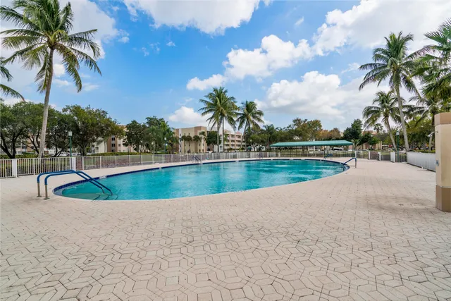 an aerial view of a house with a swimming pool