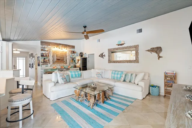 a living room with fireplace furniture and a flat screen tv