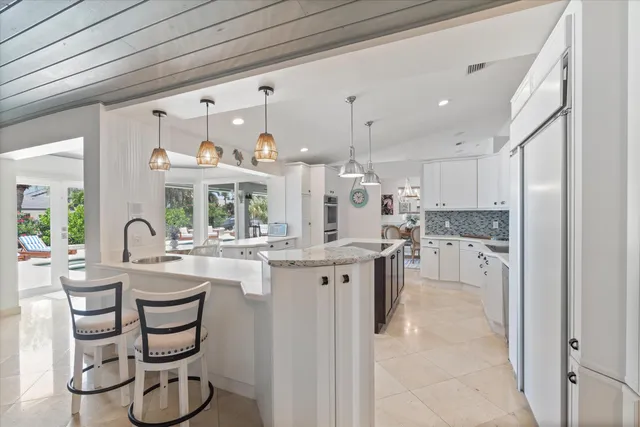 a room with a bed and a chandelier