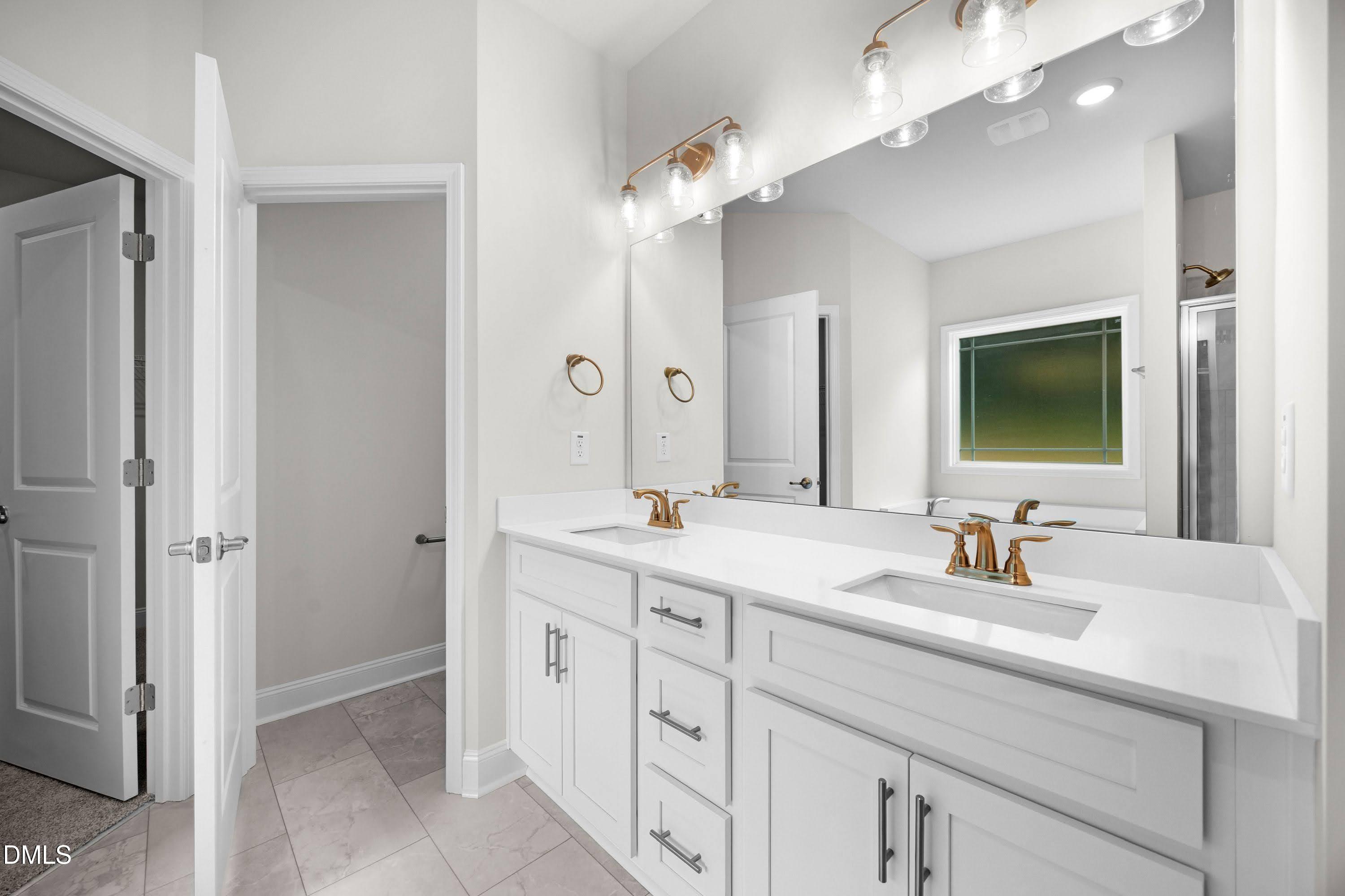 88 Galway Road Lillington, NC 27546 - Photo 20 of 36 a bathroom with a double vanity sink mirror and