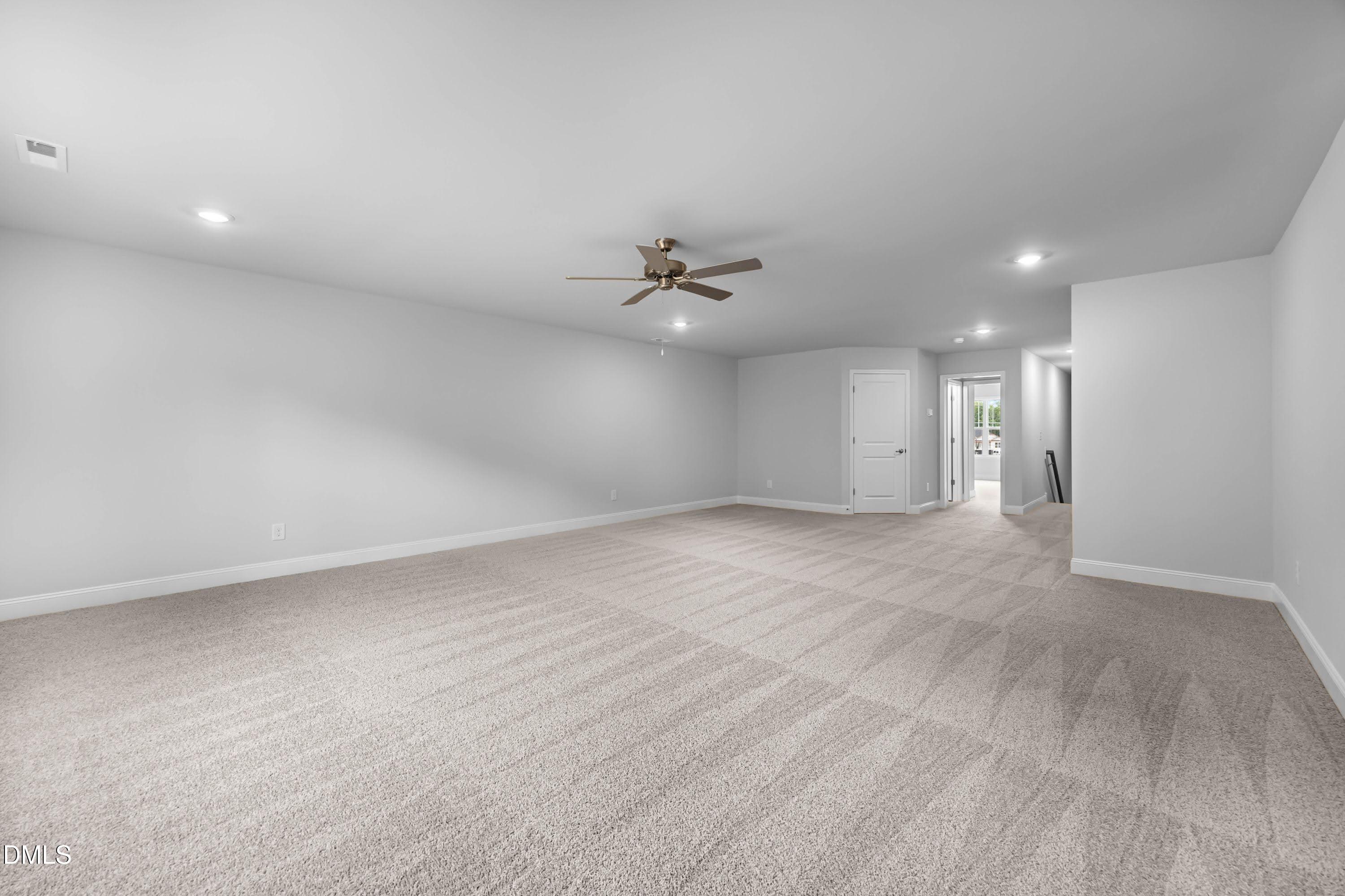 88 Galway Road Lillington, NC 27546 - Photo 32 of 36 an empty room with a ceiling fan and a window
