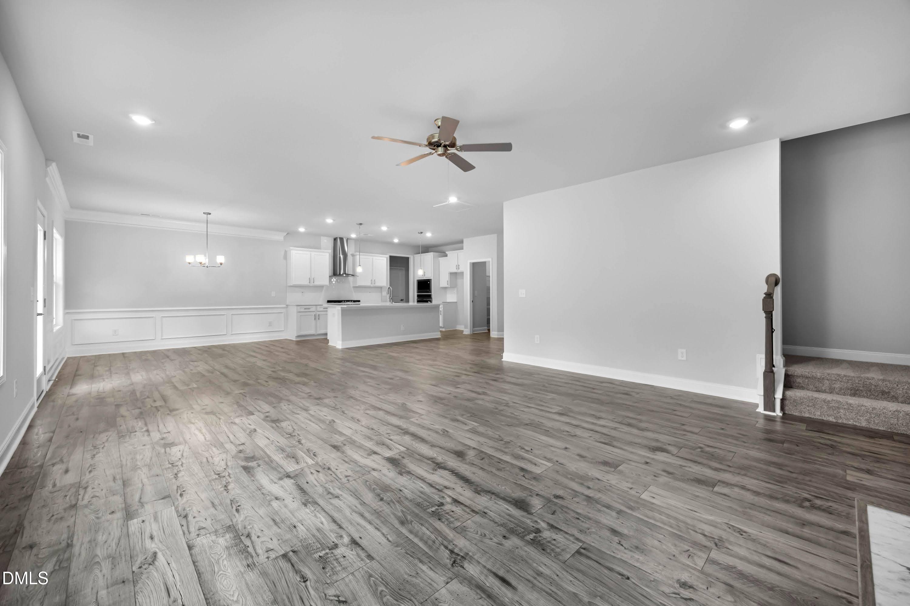 88 Galway Road Lillington, NC 27546 - Photo 4 of 36 a view of a kitchen with a sink and dishwasher a refrigerator with wooden floor