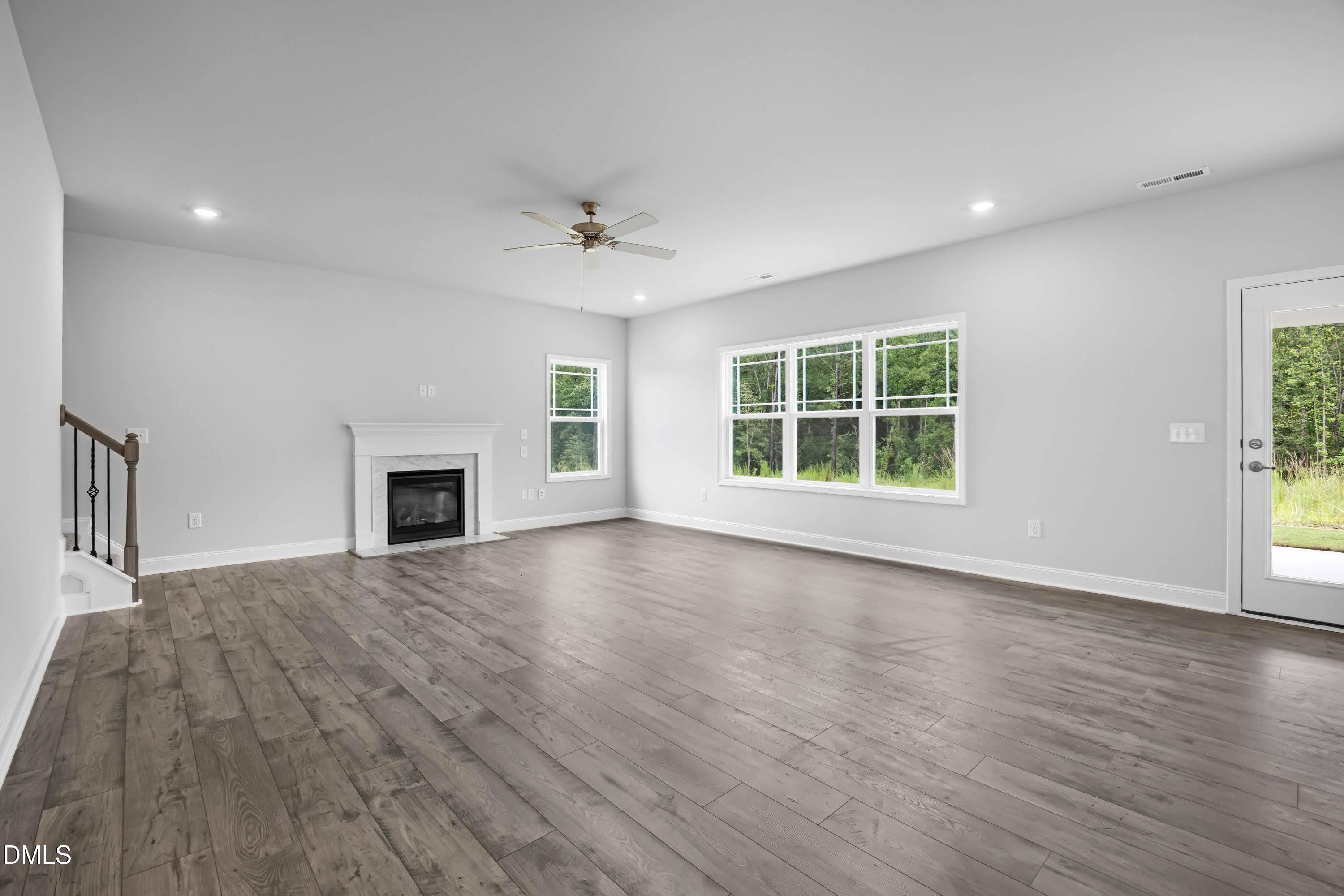 88 Galway Road Lillington, NC 27546 - Photo 6 of 36 a view of an empty room with a window and fireplace