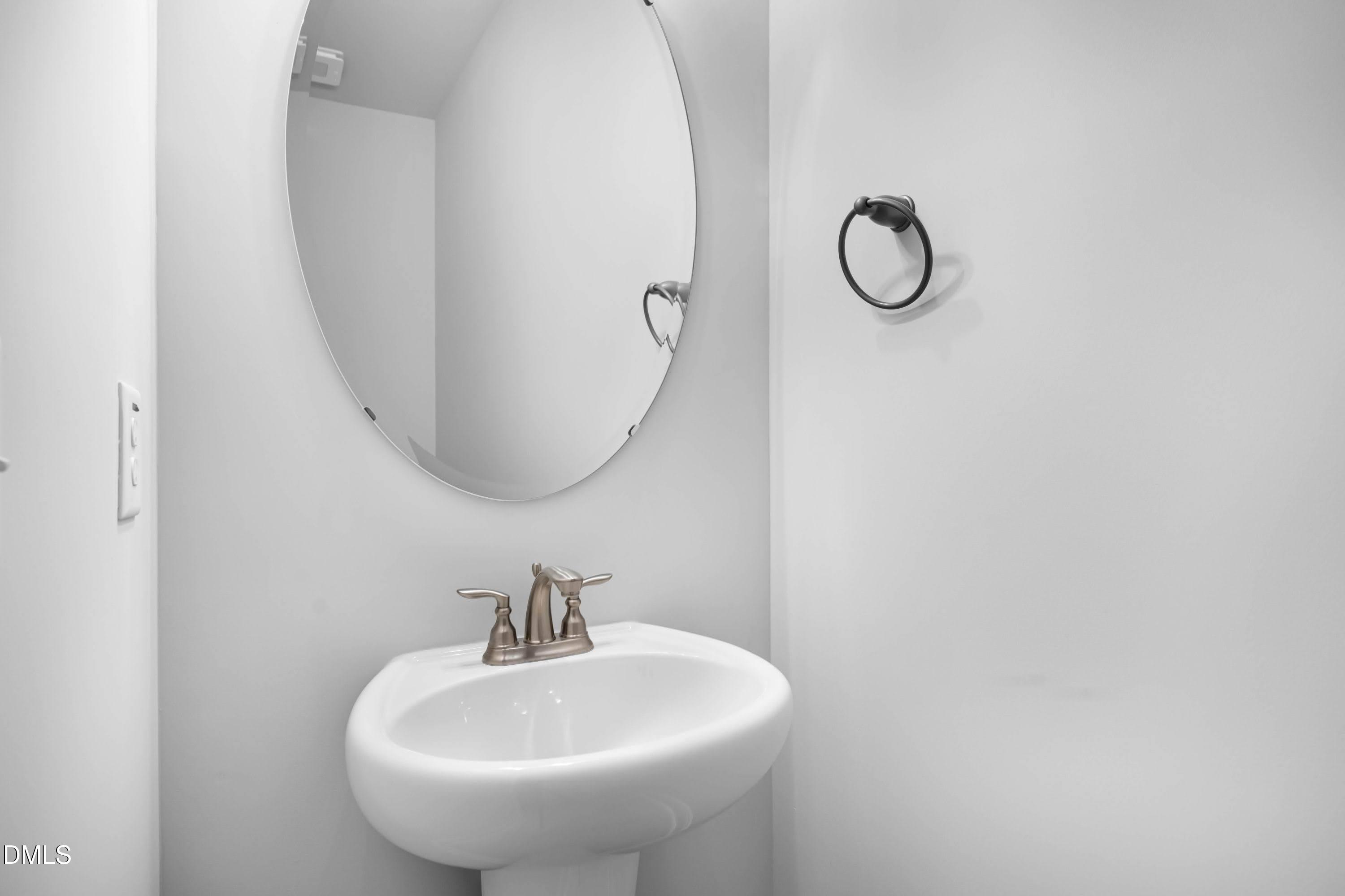 88 Galway Road Lillington, NC 27546 - Photo 7 of 36 a bathroom with a sink and a mirror