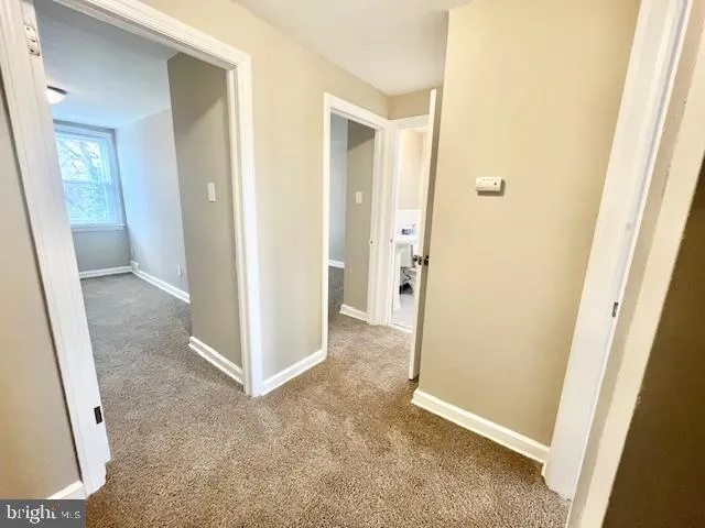 a bathroom with a bathtub and a toilet
