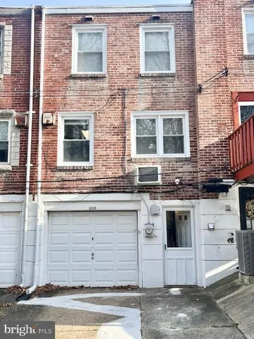 a view of yard with wooden fence