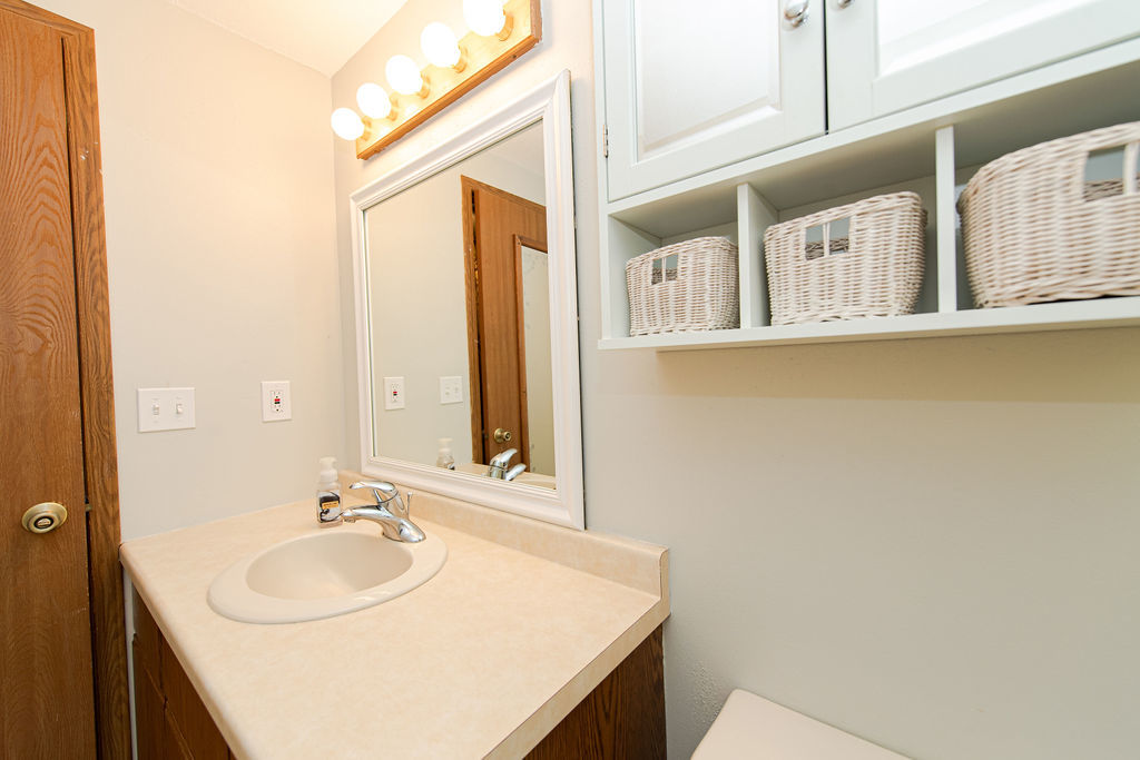25696 Raska Lane, Unit A Lake Villa, IL 60046 - Photo 11 of 31 a bathroom with a sink and a mirror