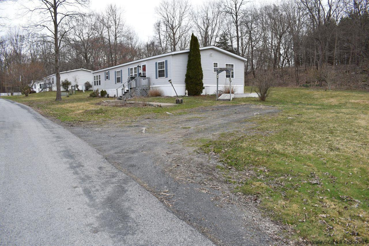 34 Depew Park Wallkill, NY 12589 - Photo 2 of 14 a white house that has a tree in front of it