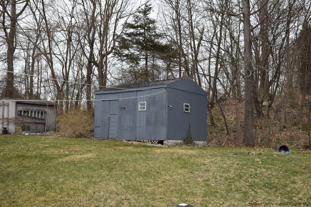 34 Depew Park Wallkill, NY 12589 - Photo 3 of 14 a front view of house with yard and trees