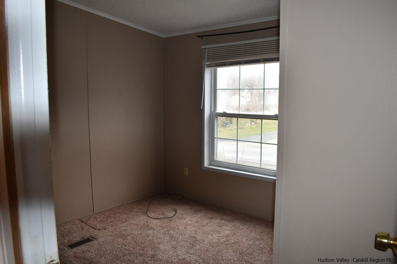 34 Depew Park Wallkill, NY 12589 - Photo 6 of 14 an empty room with windows