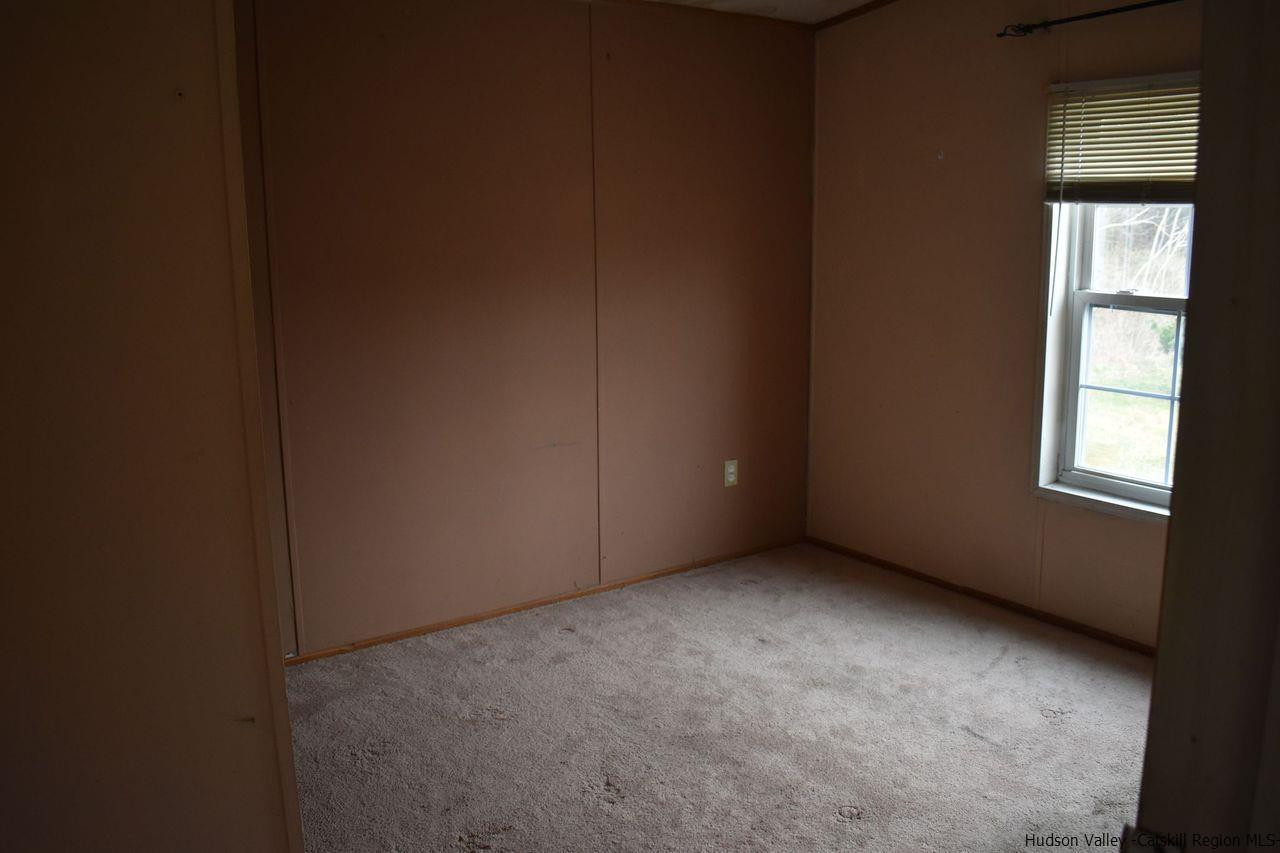 34 Depew Park Wallkill, NY 12589 - Photo 7 of 14 a view of an empty room with a window