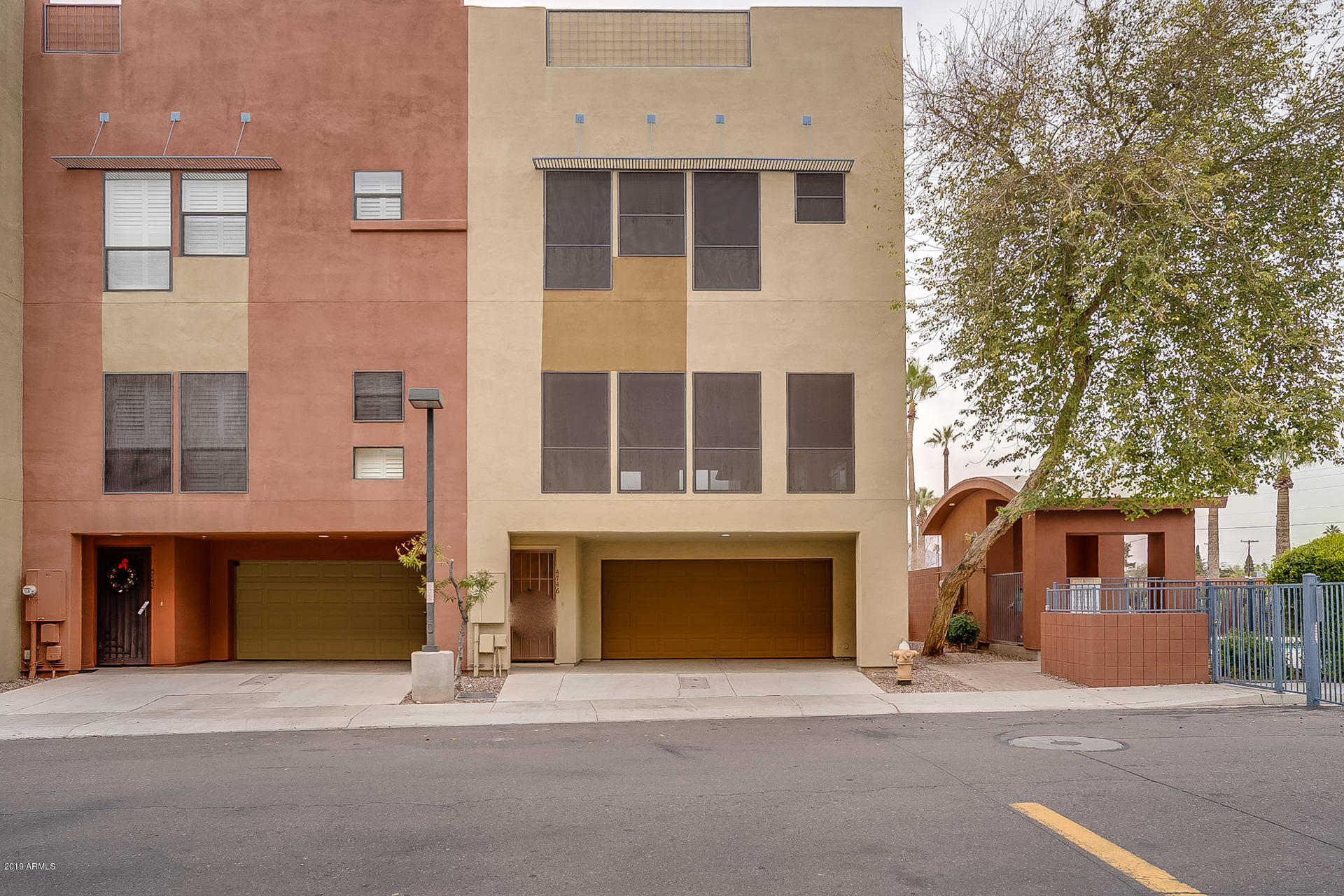 4746 East Culver Street Phoenix, AZ 85008 - Photo 1 of 13 a front view of a building with a lots of windows