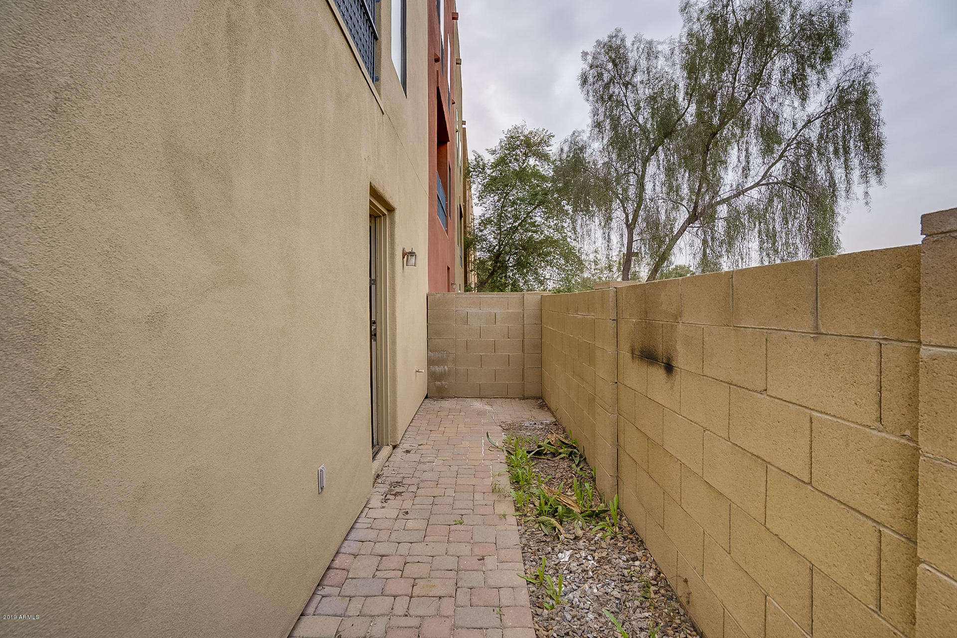 4746 East Culver Street Phoenix, AZ 85008 - Photo 5 of 13 a pathway of a house with a yard