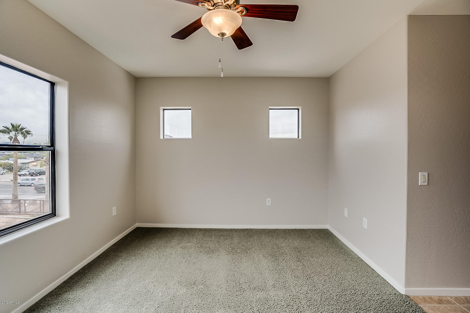 4746 East Culver Street Phoenix, AZ 85008 - Photo 8 of 13 a view of an empty room with a window