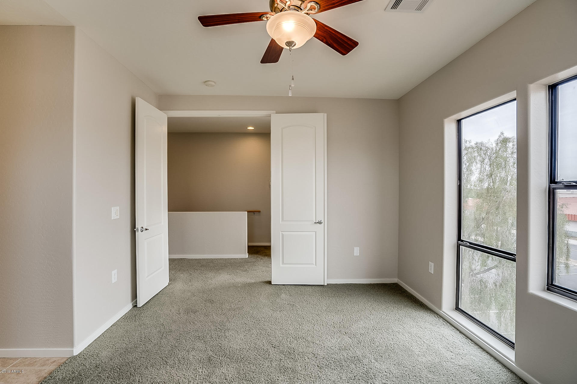 4746 East Culver Street Phoenix, AZ 85008 - Photo 9 of 13 a view of an empty room with a window