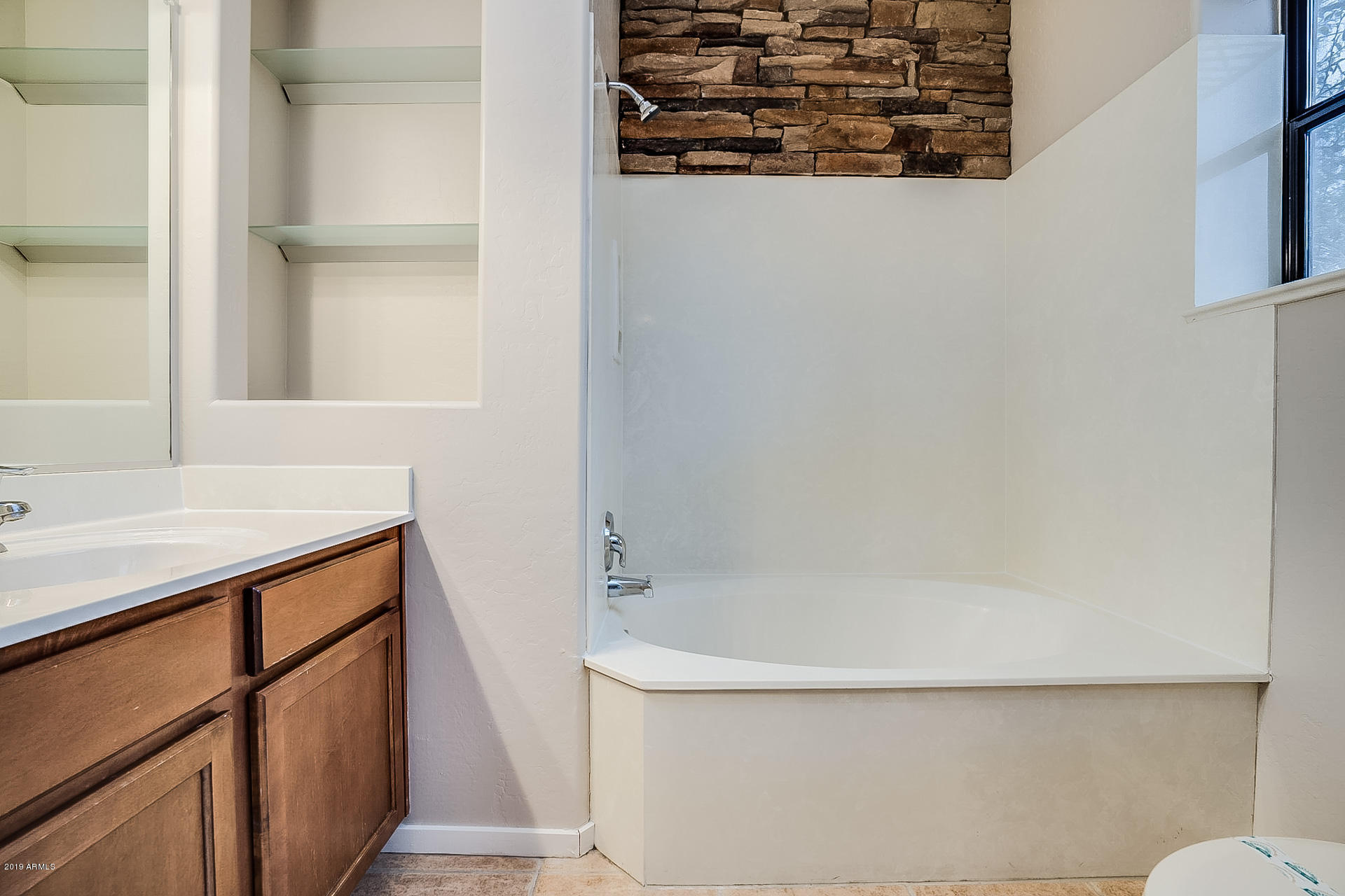 4746 East Culver Street Phoenix, AZ 85008 - Photo 10 of 13 a bathroom with a bathtub and a sink