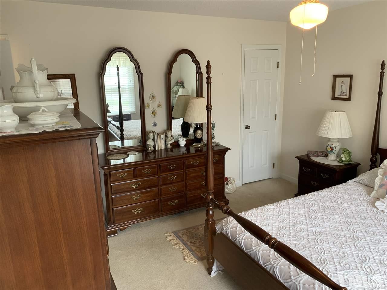 895 Keith Hills Road Lillington, NC 27546 - Photo 14 of 22 Door on left is small walk in closet, bathroom door is located behind the entry door for the room.