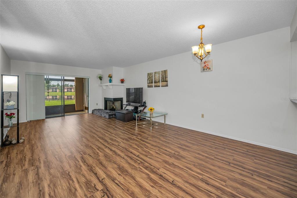 103 Lakeview Place, Unit 3 Oldsmar, FL 34677 - Photo 12 of 54 an empty room with furniture and wooden floor