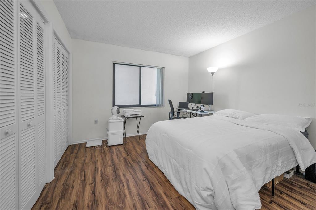 103 Lakeview Place, Unit 3 Oldsmar, FL 34677 - Photo 29 of 54 a bedroom with a bed and a table