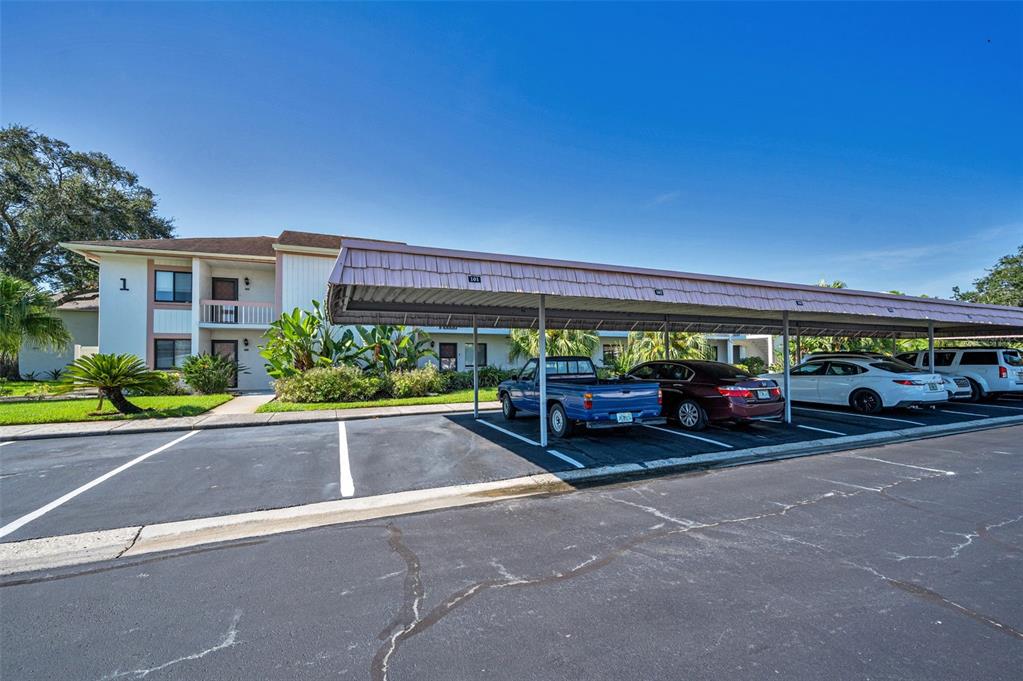 103 Lakeview Place, Unit 3 Oldsmar, FL 34677 - Photo 5 of 54 a view of a cars park in front of a building