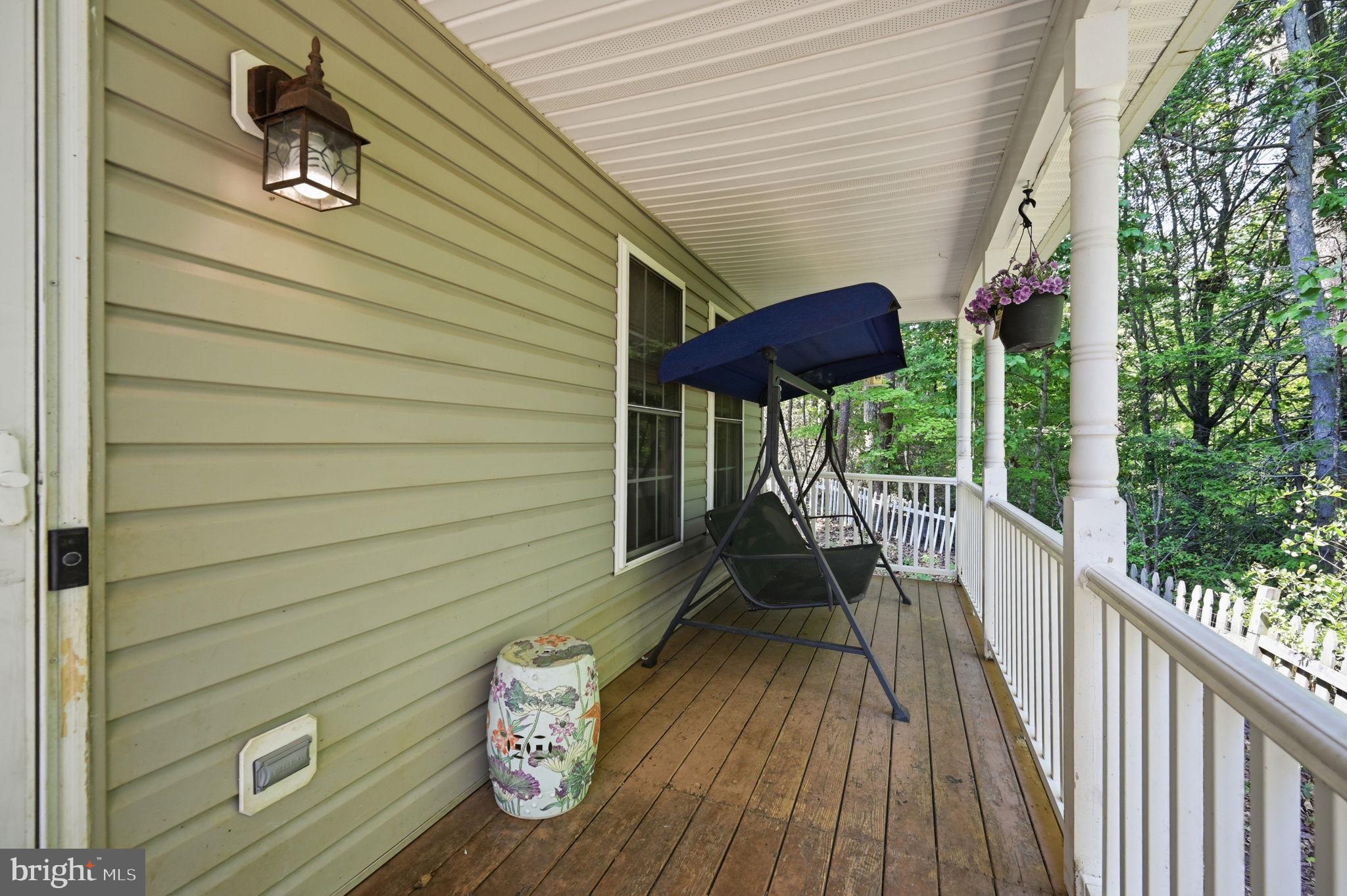 20 Raspberry Lane Stafford, VA 22554 - Photo 3 of 34 Front porch- swing can convey