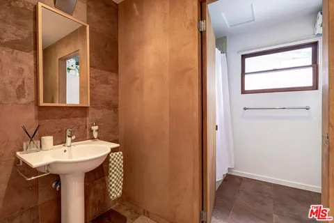 a bathroom with a sink and mirror