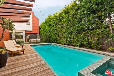 a view of swimming pool with lounge chair