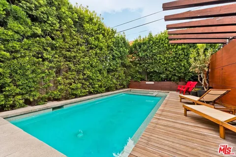 a view of a pool with a patio