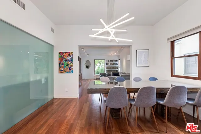 a view of a dining room with furniture and wooden floor