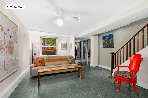 a bedroom with furniture and a window