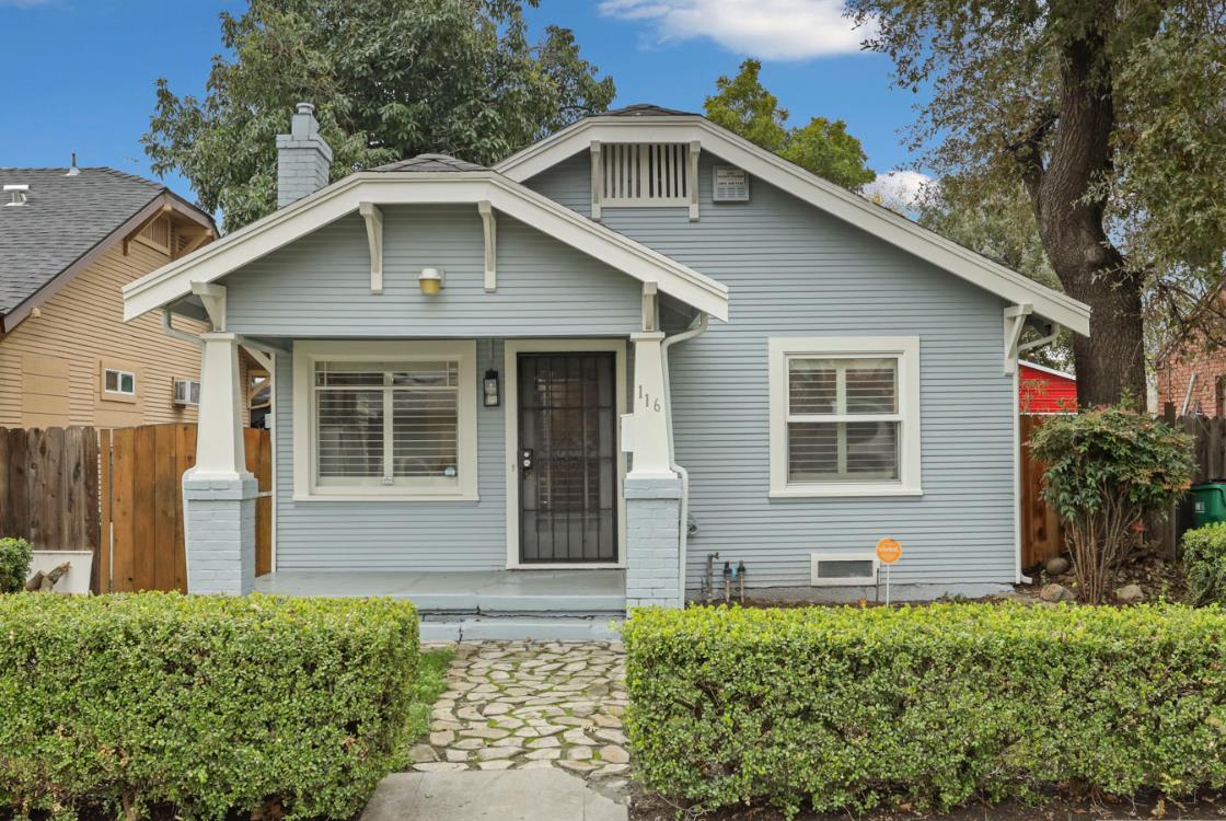 116 East Noble Street Stockton, CA 95204 - Photo 1 of 27 Craftsman style Bungalow in Central Stockton, CA. The front of the home has a lush hedged yard with stone walkway up to a covered porch. The classic craftsman chunky tapered column rest on a brick base. A touch of a hip roof and decorative brackets. Isn't it the cutest??