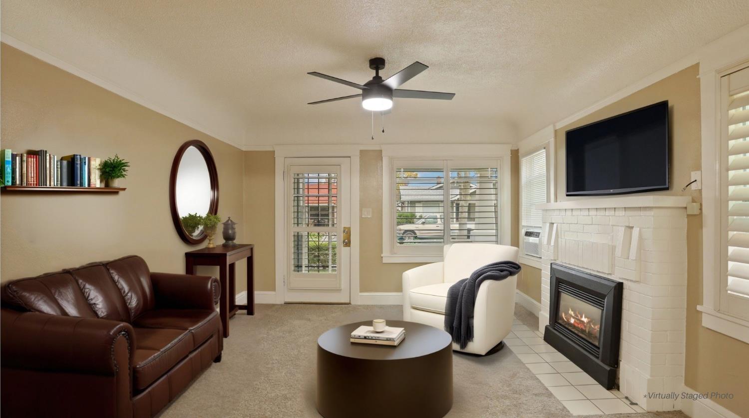 116 East Noble Street Stockton, CA 95204 - Photo 3 of 27 A little AI Inspiration for your front living room space. The fireplace does have a gas insert to help keep you cozy on those cold nights.