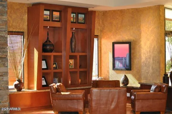 a room with pool tables and chairs