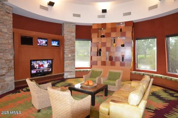 a living room with lots of furniture and a chandelier